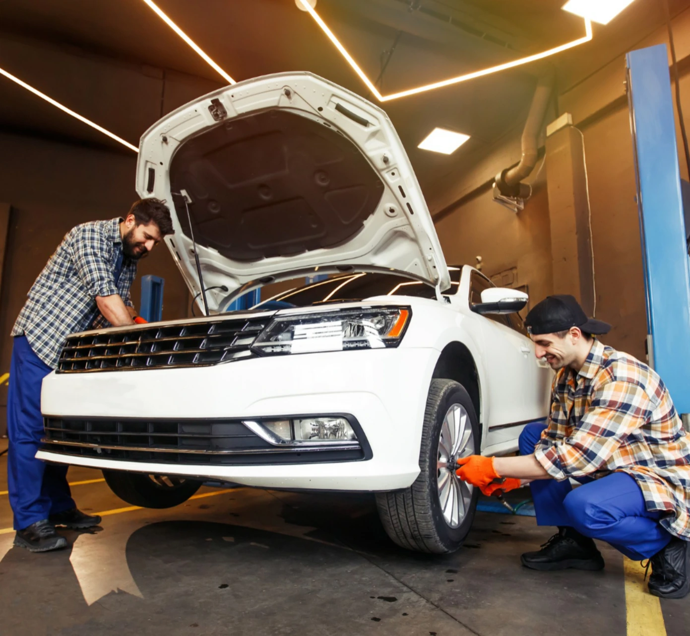 Mechanic working on car engine